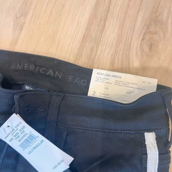 Black hi-rise NE(X)T level jegging with side stripe. - Picture 3 of 3